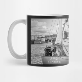 Traditional sailing boat moored in the docks in the seaside town of Great Yarmouth Mug